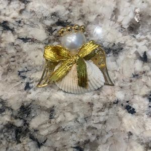 Seashell angel pin/brooch.